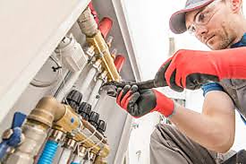 HVAC technician using JobMate to manage jobs and invoicing