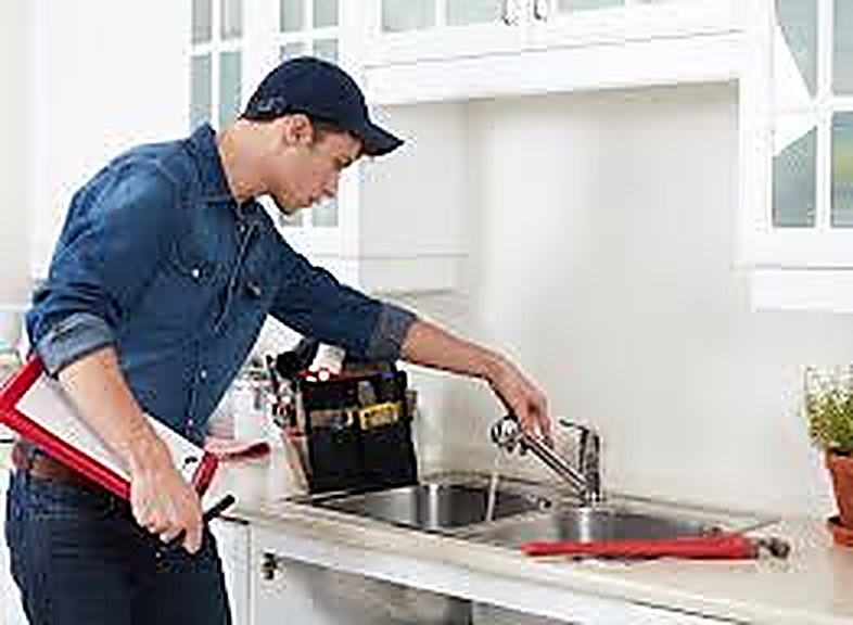 Plumber using JobMate to manage jobs and invoicing